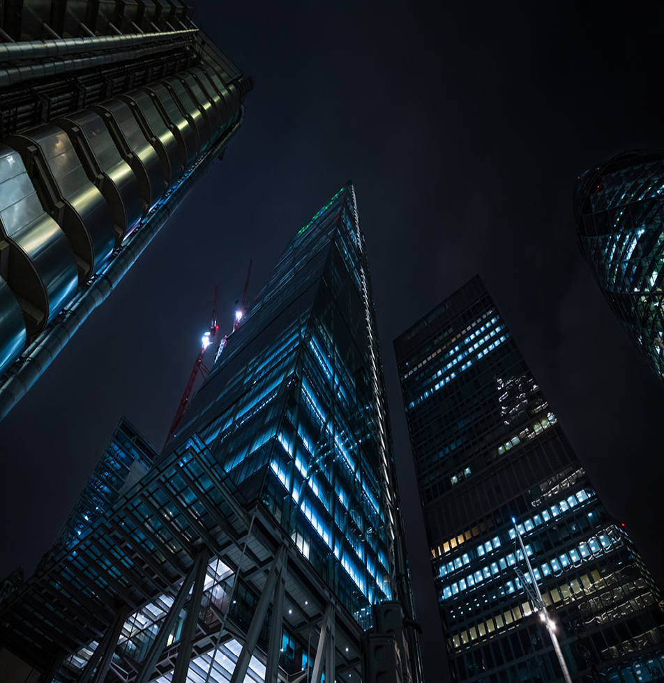 View of London skyscraper  at night from below 
