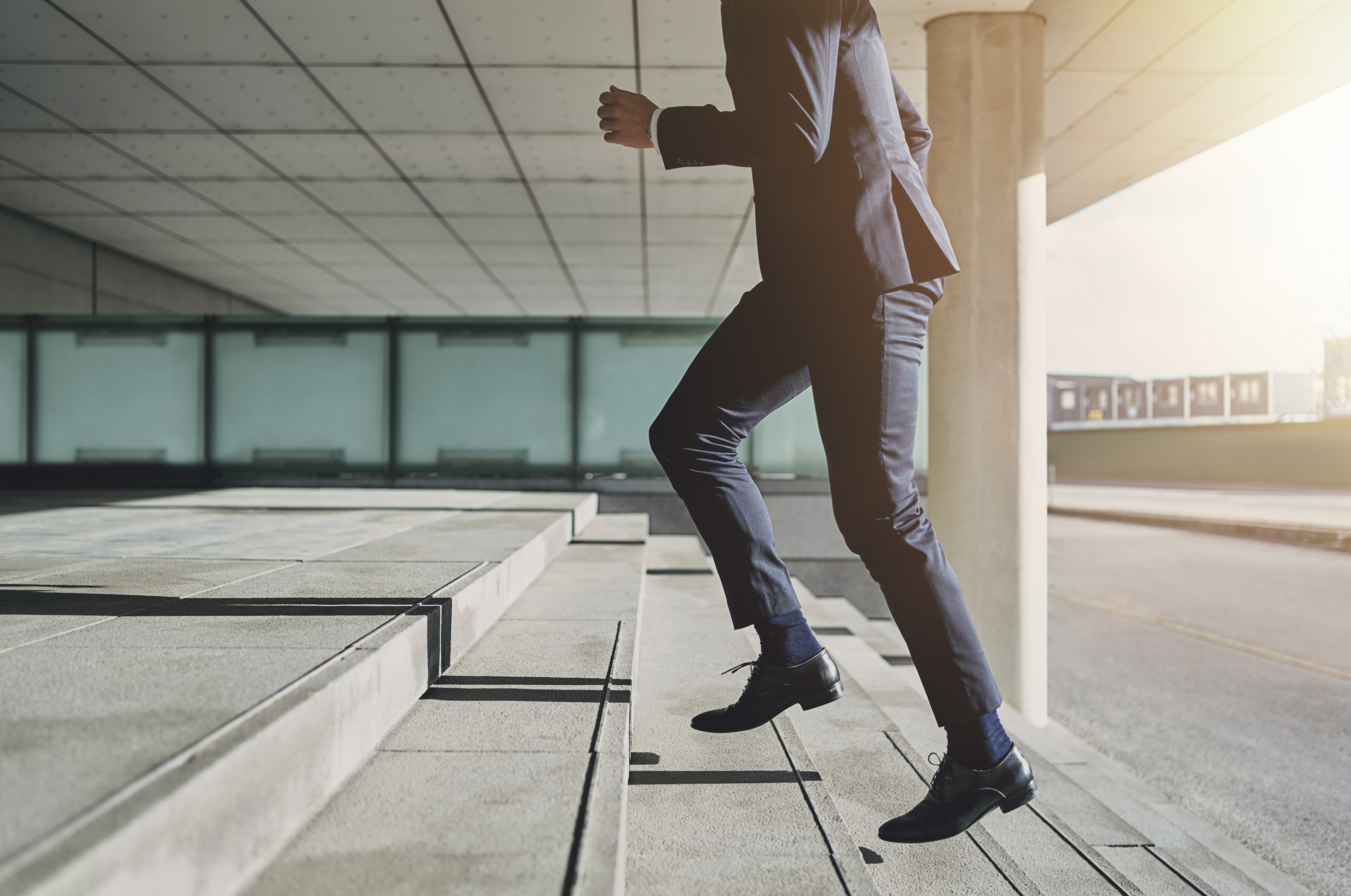 man running up stairs [image]