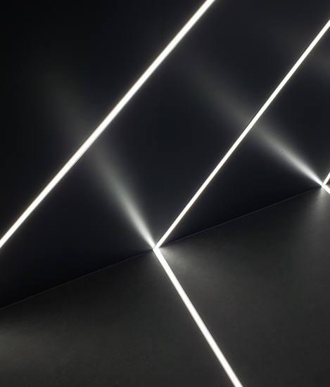 B&W image of roof with lines of lights running through