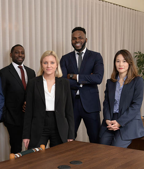 People smiling whilst posing for a picture