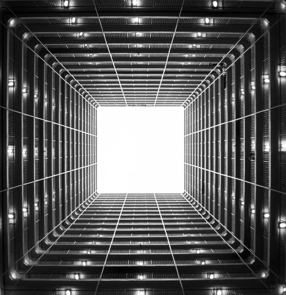 Upwards view of a sky scrapper in B&W